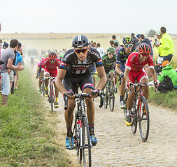 Image showing The Peloton on a Cobblestone Road - Tour de France 2015