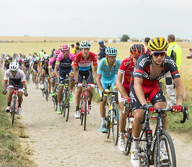 Image showing The Peloton on a Cobblestone Road - Tour de France 2015