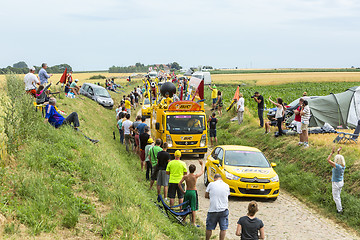 Image showing BIC Caravan on a Cobblestone Road- Tour de France 2015