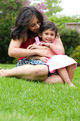Image showing Mother and daughter playing outside