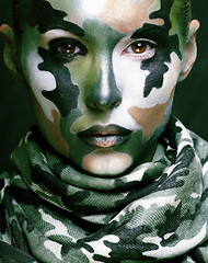 Image showing Beautiful young fashion woman with military style clothing and f