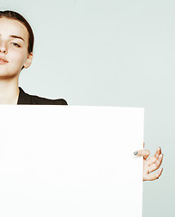 Image showing young pretty brunette girl with placard on white background