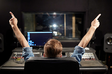 Image showing man at mixing console in music recording studio