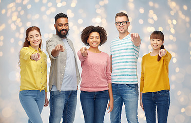 Image showing international group of people pointing on you