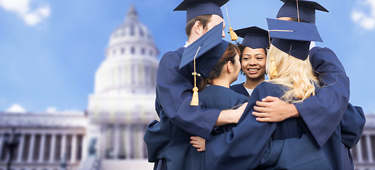 Image showing happy students or bachelors hugging