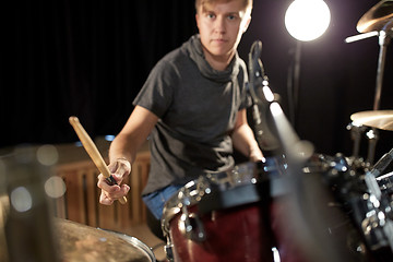 Image showing male musician playing drums and cymbals at concert