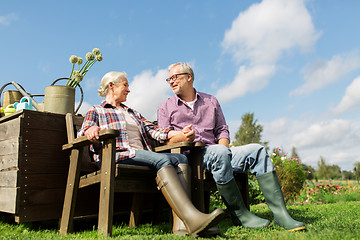 Image showing happy senior couple at summer farm