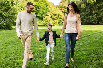 Image showing happy family walking in summer park