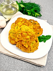 Image showing Flapjack chickpeas with zucchini in plate on stone table