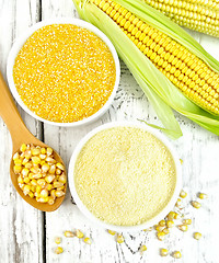 Image showing Flour and grits corn in bowls with grains on board top