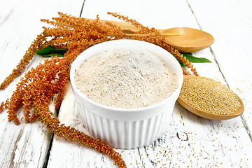 Image showing Flour amaranth in bowl with spoon and flower on board