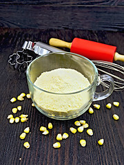 Image showing Flour corn in cup on dark board