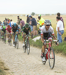 Image showing The Peloton on a Cobblestone Road - Tour de France 2015