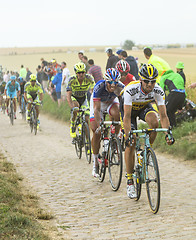 Image showing The Peloton on a Cobblestone Road - Tour de France 2015