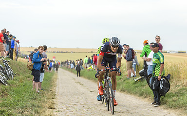 Image showing The Cyclist Matthias Brandle Riding on a Cobblestone Road - Tour