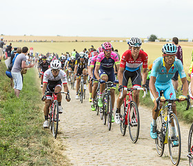 Image showing The Peloton on a Cobblestone Road - Tour de France 2015