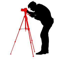 Image showing Cameraman with video camera. Silhouettes on white background. illustration