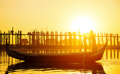 Image showing Fishman under U bein bridge at sunset