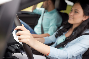 Image showing happy man and woman driving in car