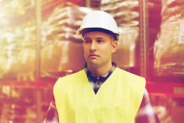 Image showing man in hardhat and safety vest at warehouse