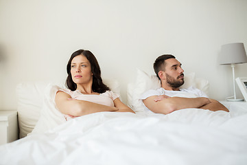 Image showing unhappy couple having conflict in bed at home