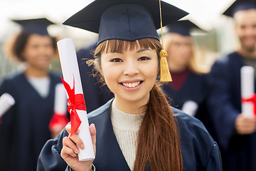 Image showing close up of happy student or bachelor with diploma