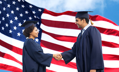 Image showing happy students or bachelors greeting each other