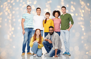 Image showing international group of happy people over lights