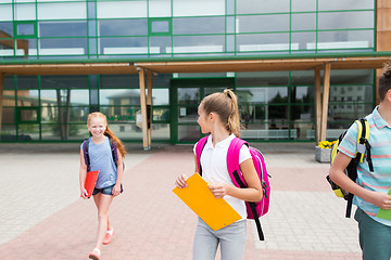 Image showing happy elementary school students with folders