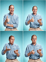 Image showing The young smiling caucasian man on blue background