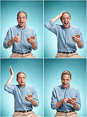 Image showing The young smiling caucasian man on blue background