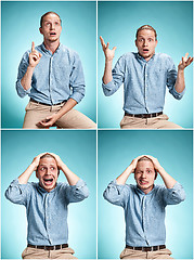 Image showing The surprised young man over blue background