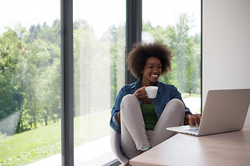 Image showing African American woman in the living room