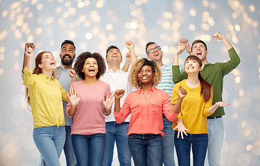 Image showing international group of happy people over lights