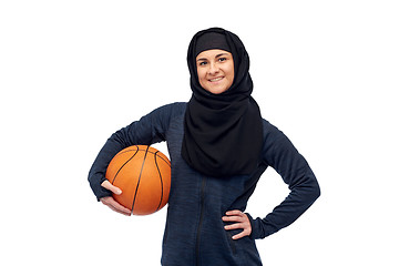 Image showing happy muslim woman in hijab with basketball