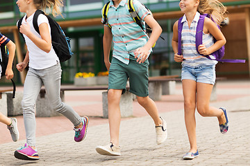 Image showing group of happy elementary school students running