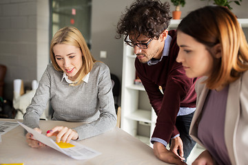 Image showing happy business team with papers in office