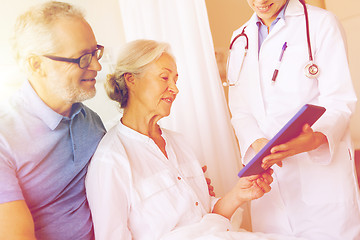 Image showing senior woman and doctor with tablet pc at hospital