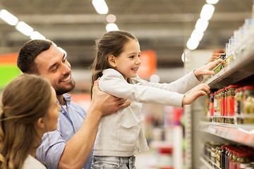 Image showing happy family buying food at grocery store