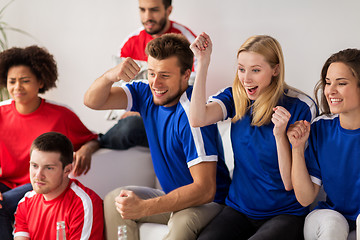 Image showing friends or football fans watching soccer at home