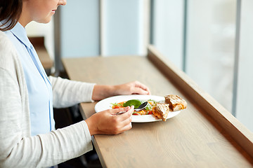 Image showing woman eating gazpacho soup at restaurant