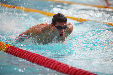 Image showing  swimmer in motion in a spray of water