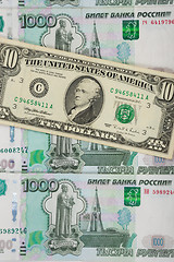 Image showing Thousandths bills Russian ruble covered ten dollars