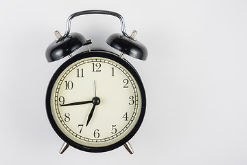 Image showing Alarm clock on a white background, to the right place for an inscription