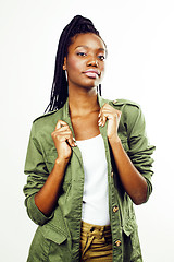 Image showing young pretty african-american girl posing cheerful emotional on white background isolated, lifestyle people concept