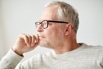 Image showing close up of senior man in glasses thinking