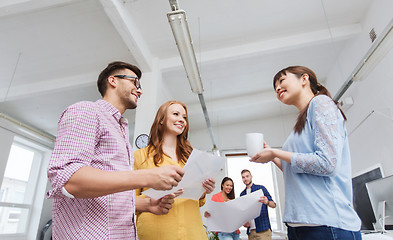 Image showing creative team on coffee break talking at office