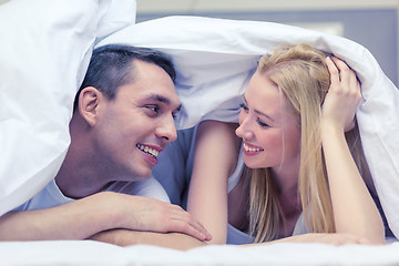 Image showing happy couple sleeping in bed
