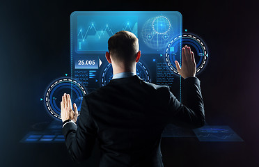 Image showing businessman working with virtual screens