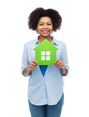 Image showing happy african american woman with green house icon